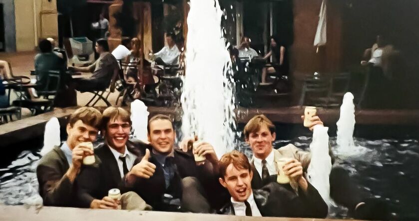 5 friends, Christo, De Witt, JJ, Jean and Neil celebrating their last exam in a fountain.